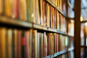 Close-up view of library shelves filled with books, ideal for concepts of education and literature.